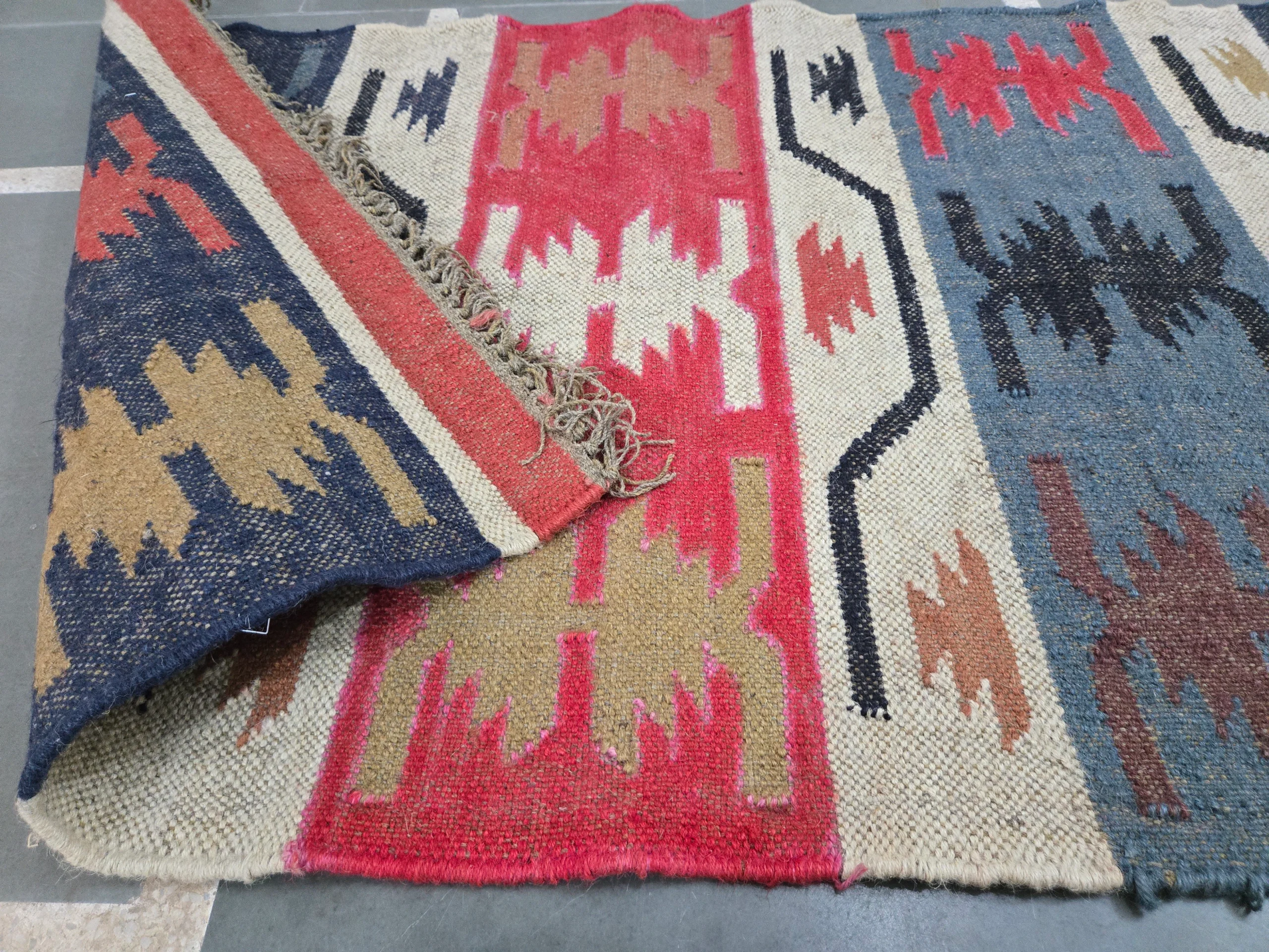 Crimson ivory tribal pattern rug