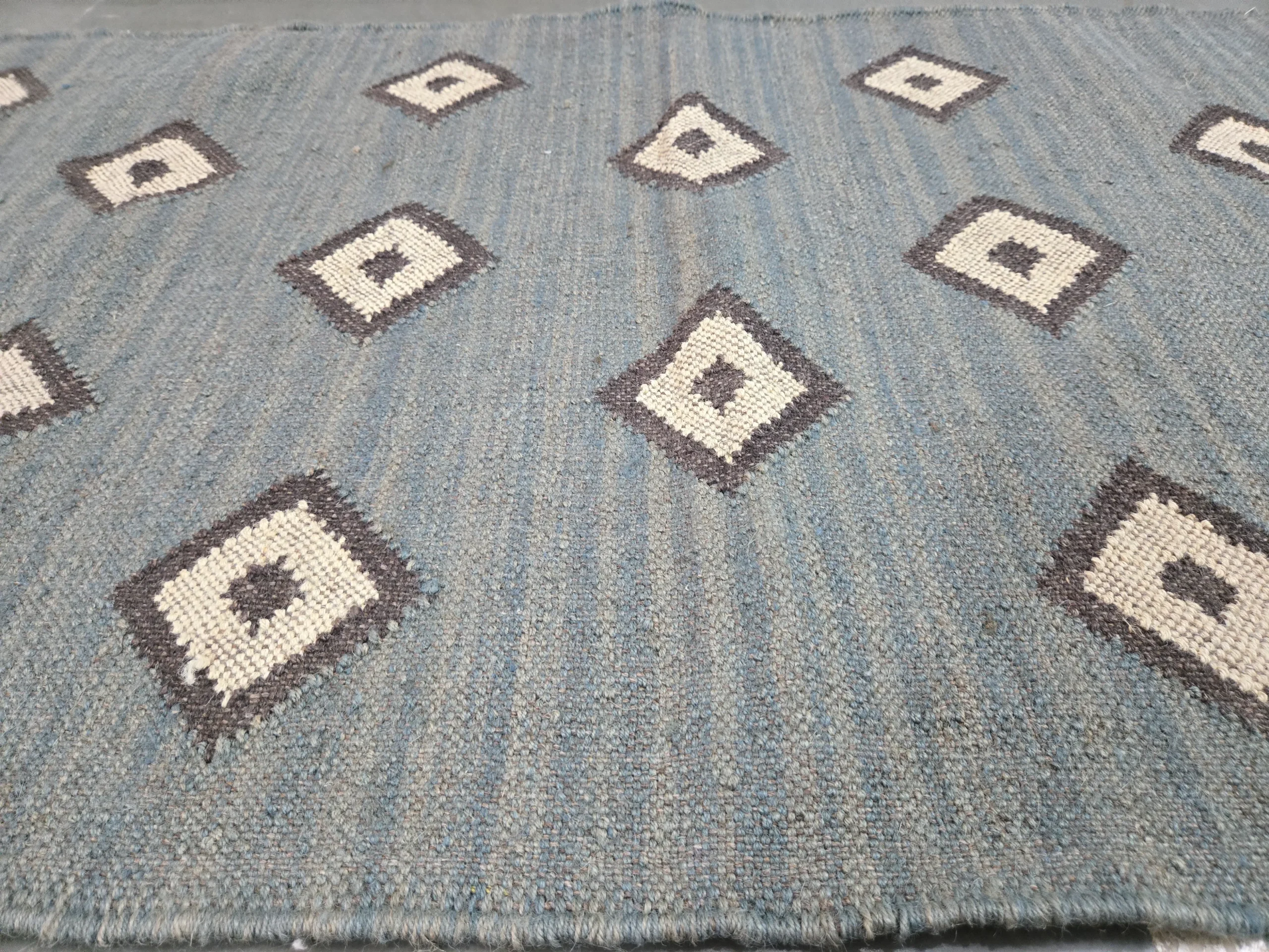 Distressed diamond pattern vintage rug