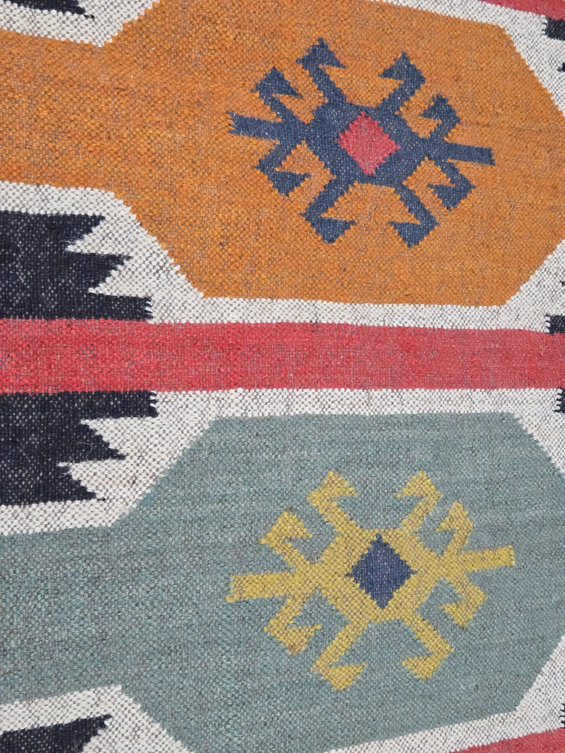 Handwoven geometric folk area rug