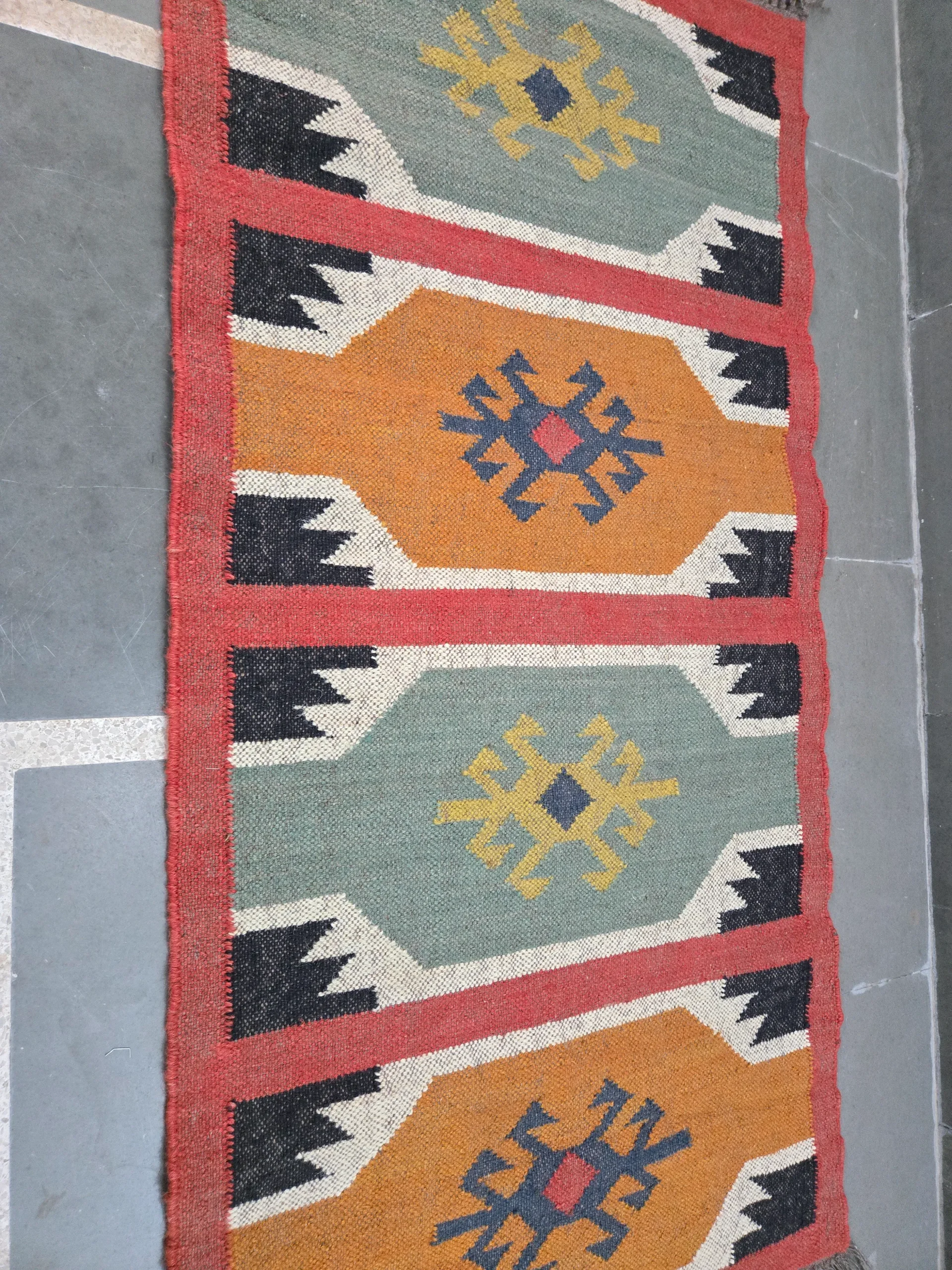 Multicolor geometric tribal rug design