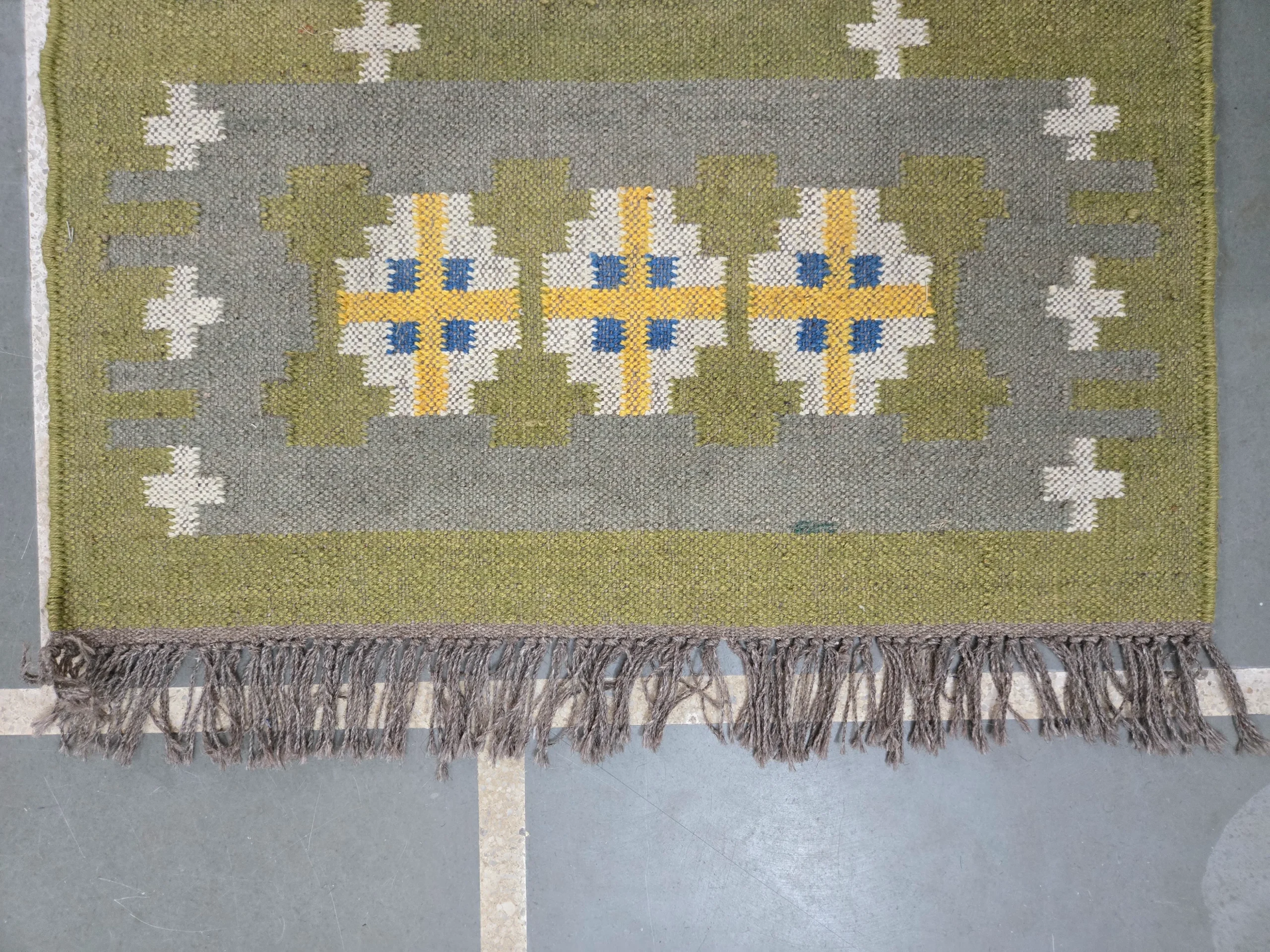 Olive green geometric kilim rug