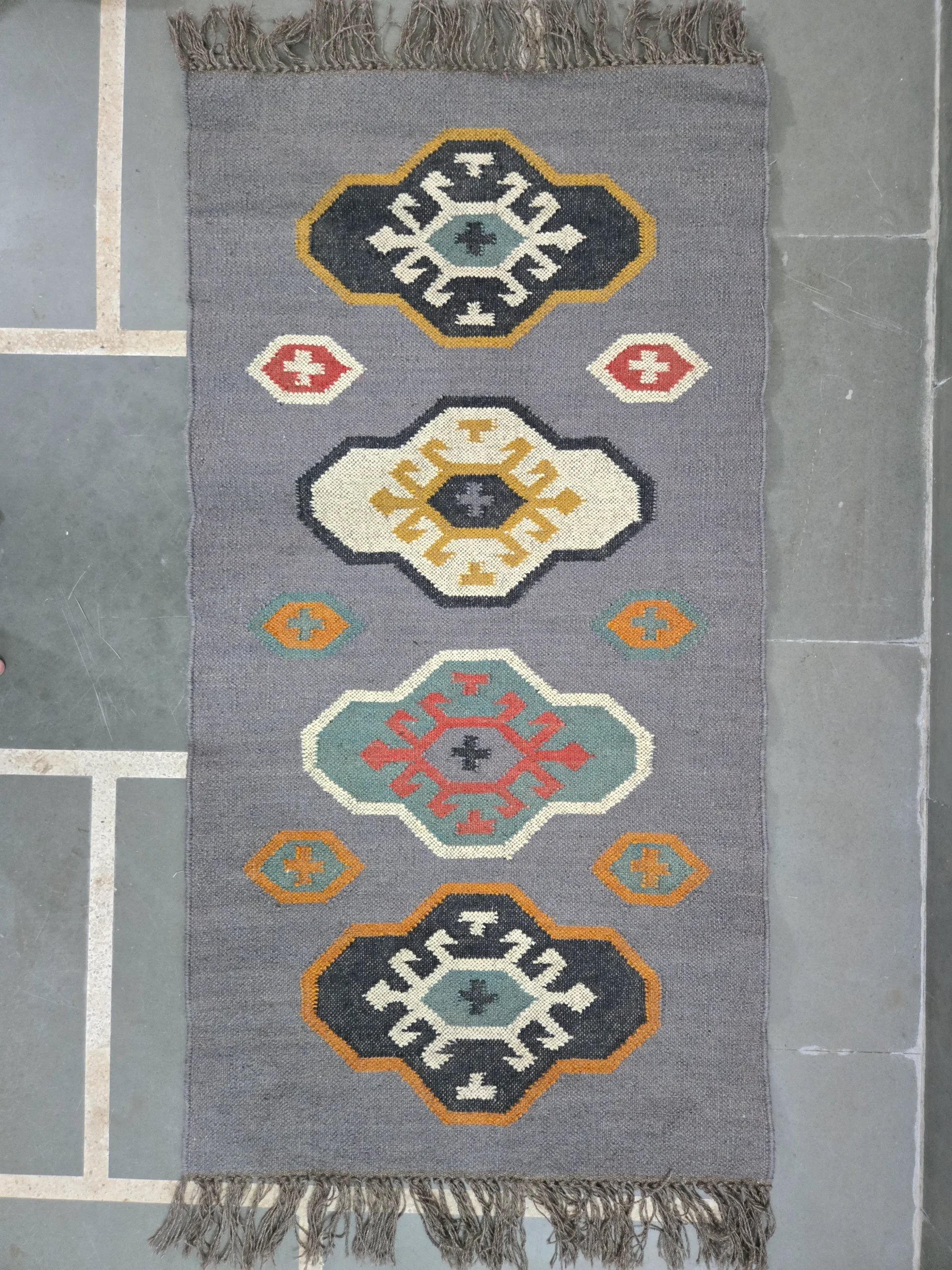 Tribal motif kilim rug design